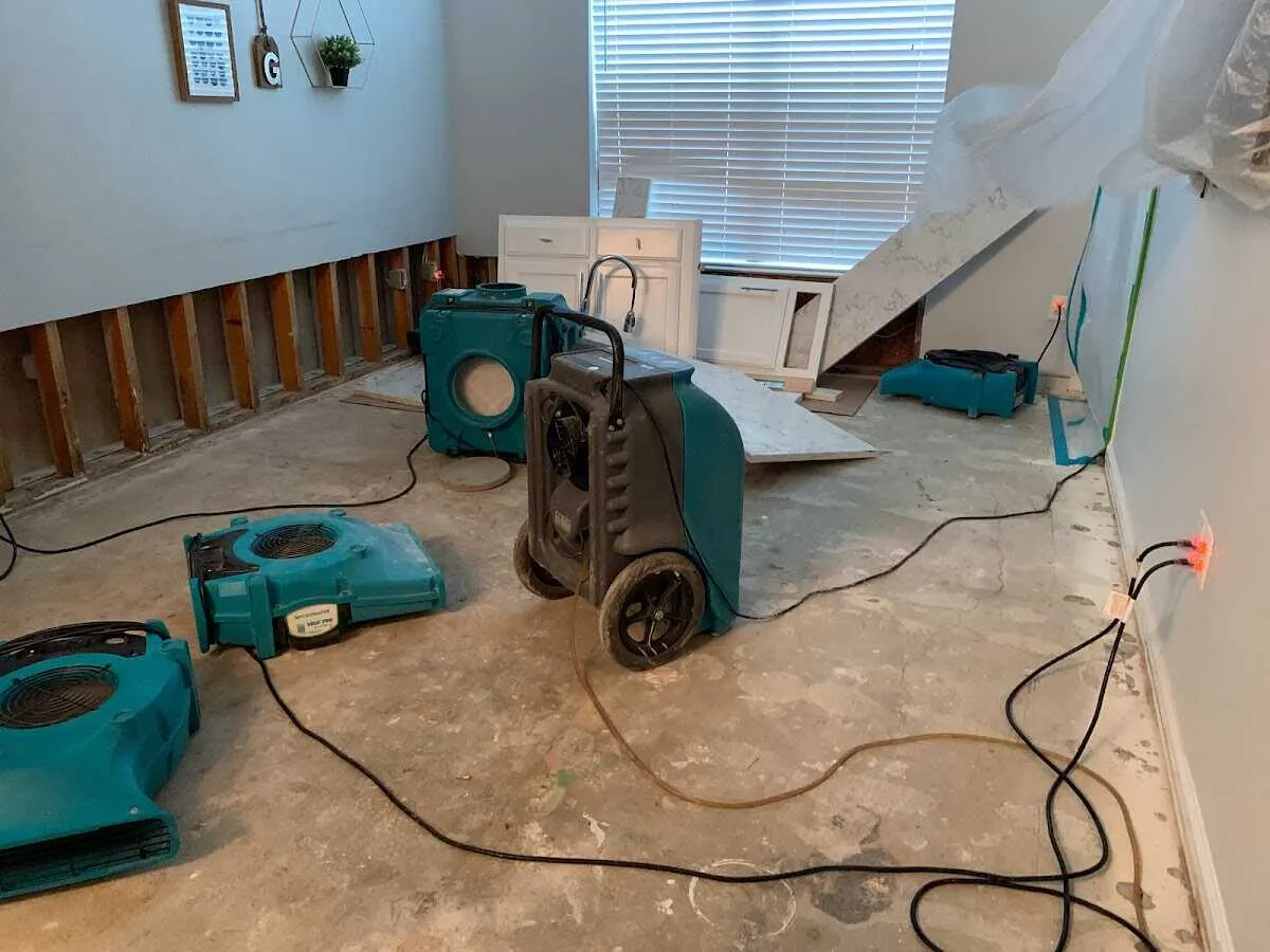 Dehumidifier in flood-cut room for Water Damage Restoration in Charlestown